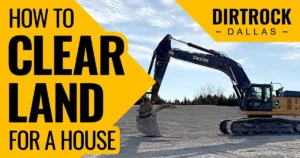 John Deere 350 excavator with bucket raised on a cleared dirt lot, tree line and blue sky in background. Text reads How to Clear Land for a House with DirtRock Dallas logo.